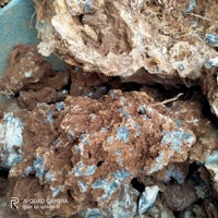 a pile of rocks and minerals in a bowl